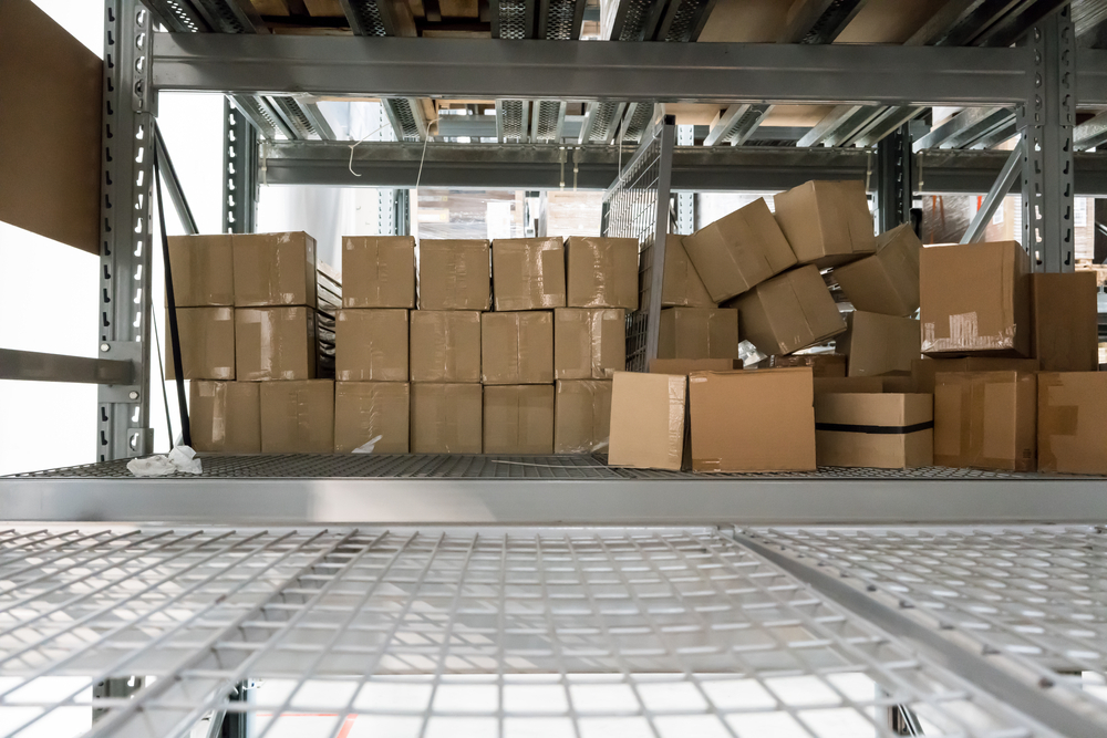 Cardboard boxes stored on metal wire shelving units