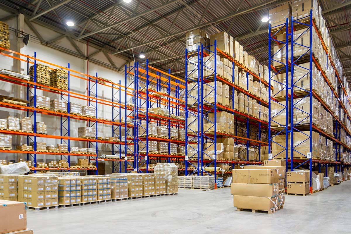 Used handling equipment in a warehouse with storage racks and pallets