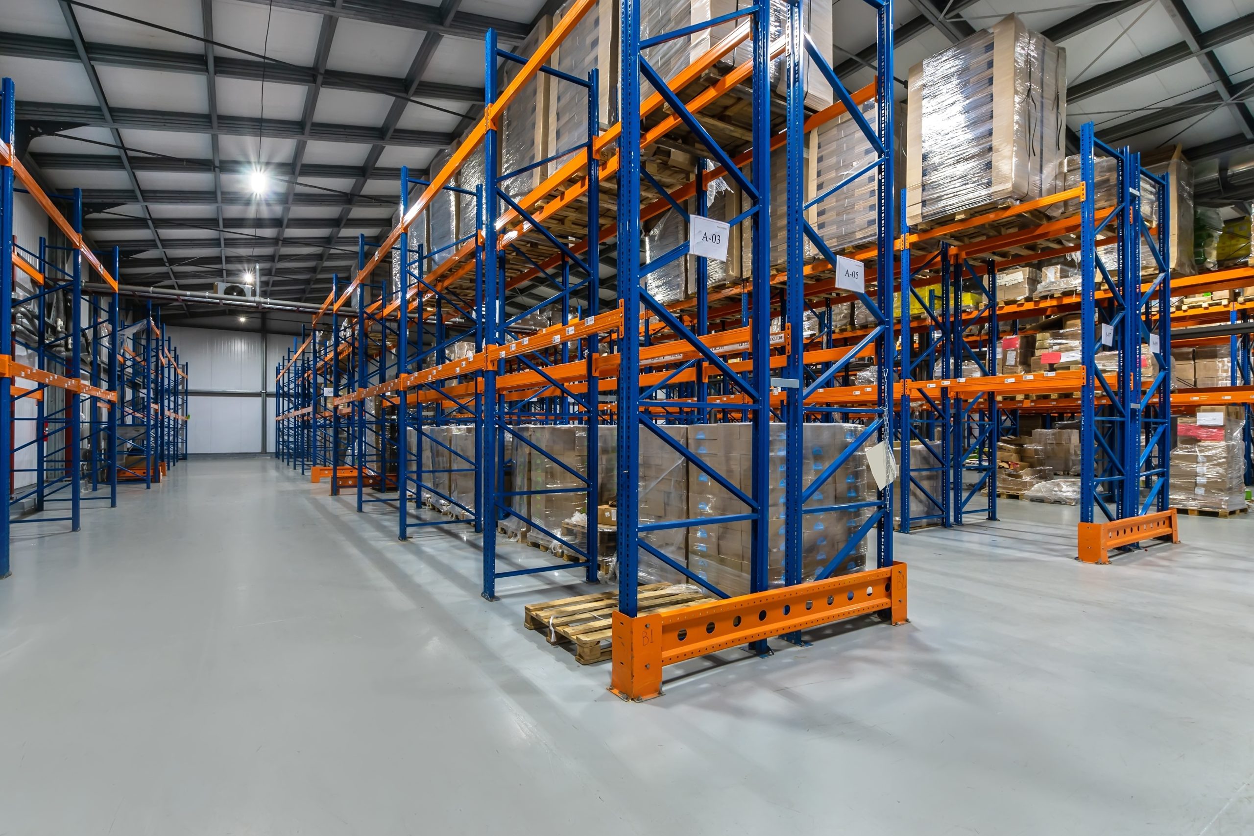 Warehouse with blue and orange installed racks