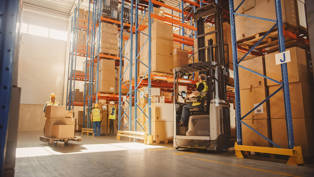 Warehouse workers organizing used storage racks