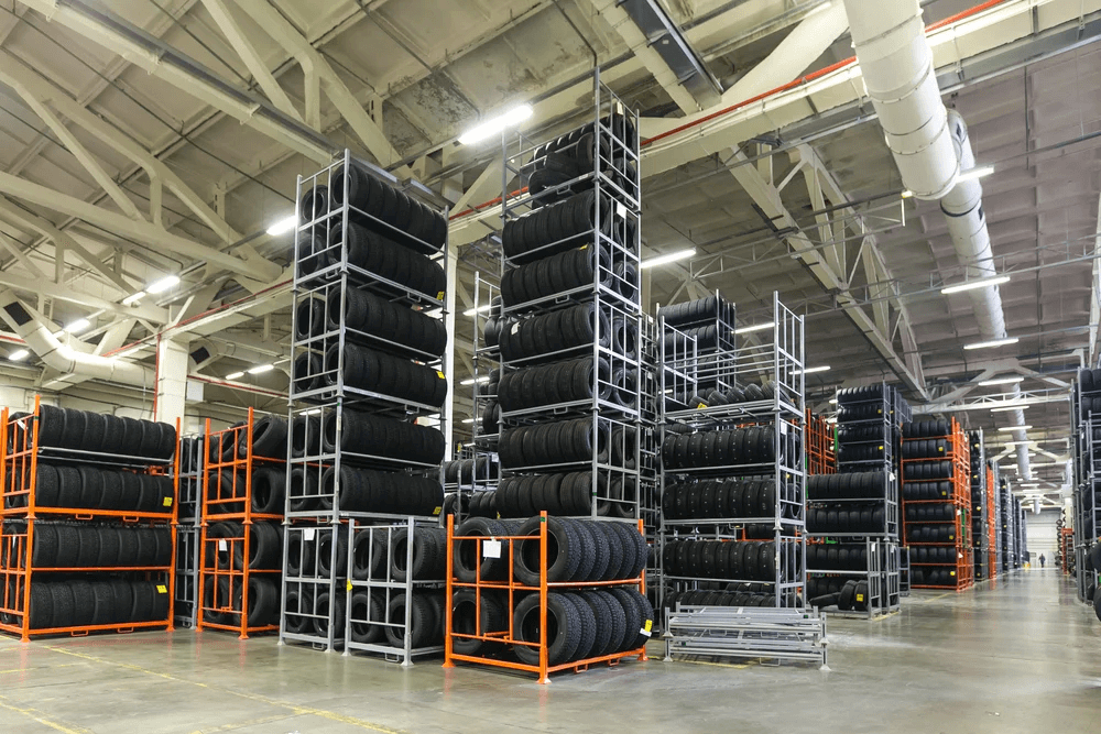 Used tire racks storing bulk tires in a warehouse